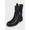 Black boots with metallic decor