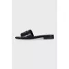 Black leather flip-flops with gold trim