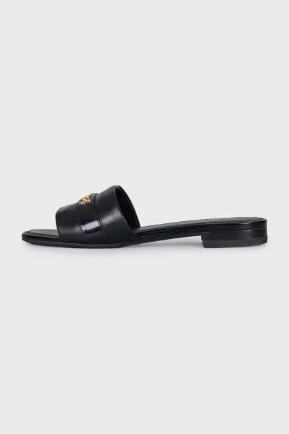 Black leather flip-flops with gold trim