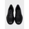 Black leather brogues