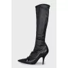 Black leather boots with a bow