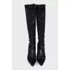 Black leather boots with a bow