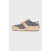 Leather and textile sneakers with a signature print