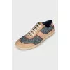 Leather and textile sneakers with a signature print