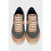 Leather and textile sneakers with a signature print
