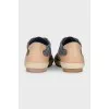 Leather and textile sneakers with a signature print