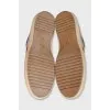 Leather and textile sneakers with a signature print