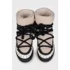 Fur boots with leather inserts