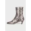 Ankle boots with embossed detailing and a beveled heel