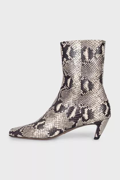 Ankle boots with embossed detailing and a beveled heel