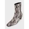 Ankle boots with embossed detailing and a beveled heel