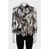 Sheer black blouse with floral print