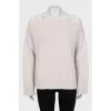 Wool jumper decorated with lace