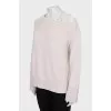 Wool jumper decorated with lace