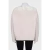 Wool jumper decorated with lace