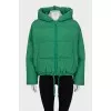 Reversible down jacket with a green hood