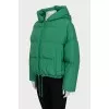 Reversible down jacket with a green hood