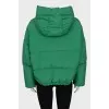 Reversible down jacket with a green hood