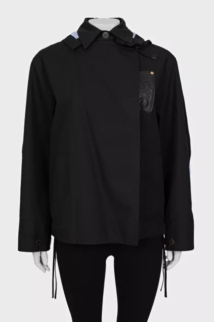 Shortened raincoat with a removable hood