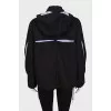 Shortened raincoat with a removable hood