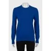 Blue jumper with patches on the sleeves
