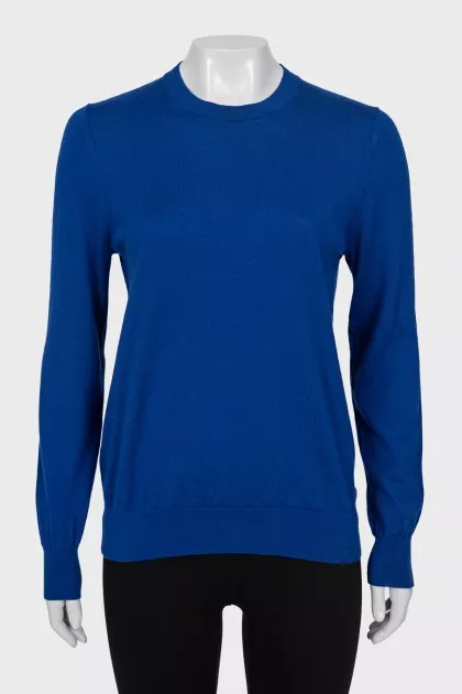 Blue jumper with patches on the sleeves