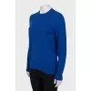 Blue jumper with patches on the sleeves