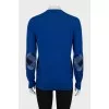 Blue jumper with patches on the sleeves