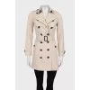 Beige double-breasted button-down trench coat