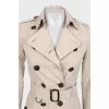 Beige double-breasted button-down trench coat