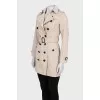 Beige double-breasted button-down trench coat