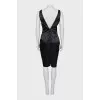 Black sheath dress with an open back