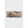 Leather clutch decorated with black lace