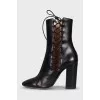Black leather lace-up ankle boots