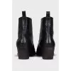 Black leather slip-on boots