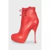 Red leather ankle boots with perforations