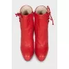 Red leather ankle boots with perforations