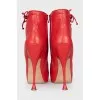 Red leather ankle boots with perforations