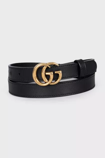 Narrow leather belt with a gold buckle