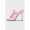 Pink mules with a shaped heel