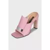 Pink mules with a shaped heel