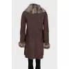 Sheepskin coat with buttons and a voluminous collar