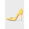 Patent leather yellow pumps
