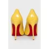 Patent leather yellow pumps