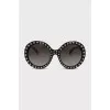 Sunglasses decorated with spikes