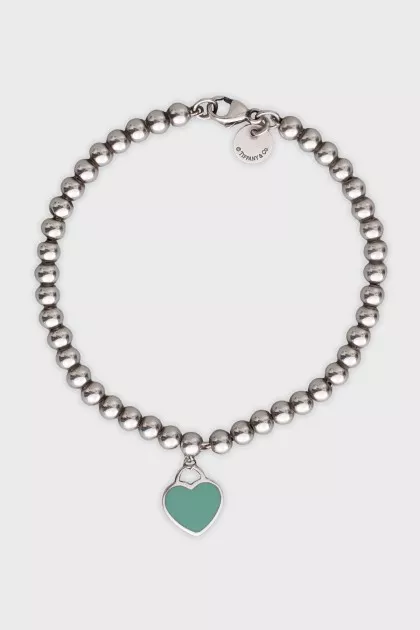 Silver bracelet with a heart pendant