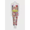 A suit with a bright print decorated with sequins