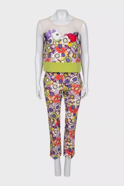 A suit with a bright print decorated with sequins