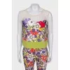 A suit with a bright print decorated with sequins