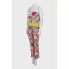A suit with a bright print decorated with sequins